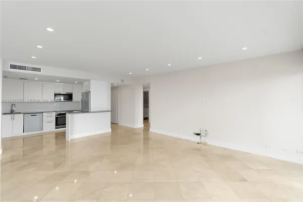 a view of a kitchen with a sink and cabinets