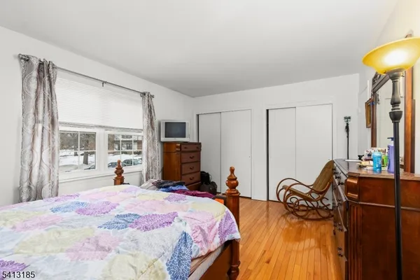 a bed room with a bed and a chair