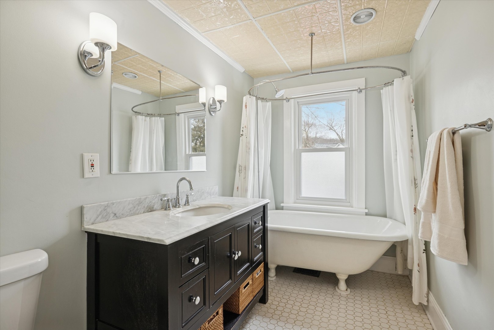 21 Division Street Algonquin, IL 60102 - Photo 13 of 20 a bathroom with a tub sink and mirror