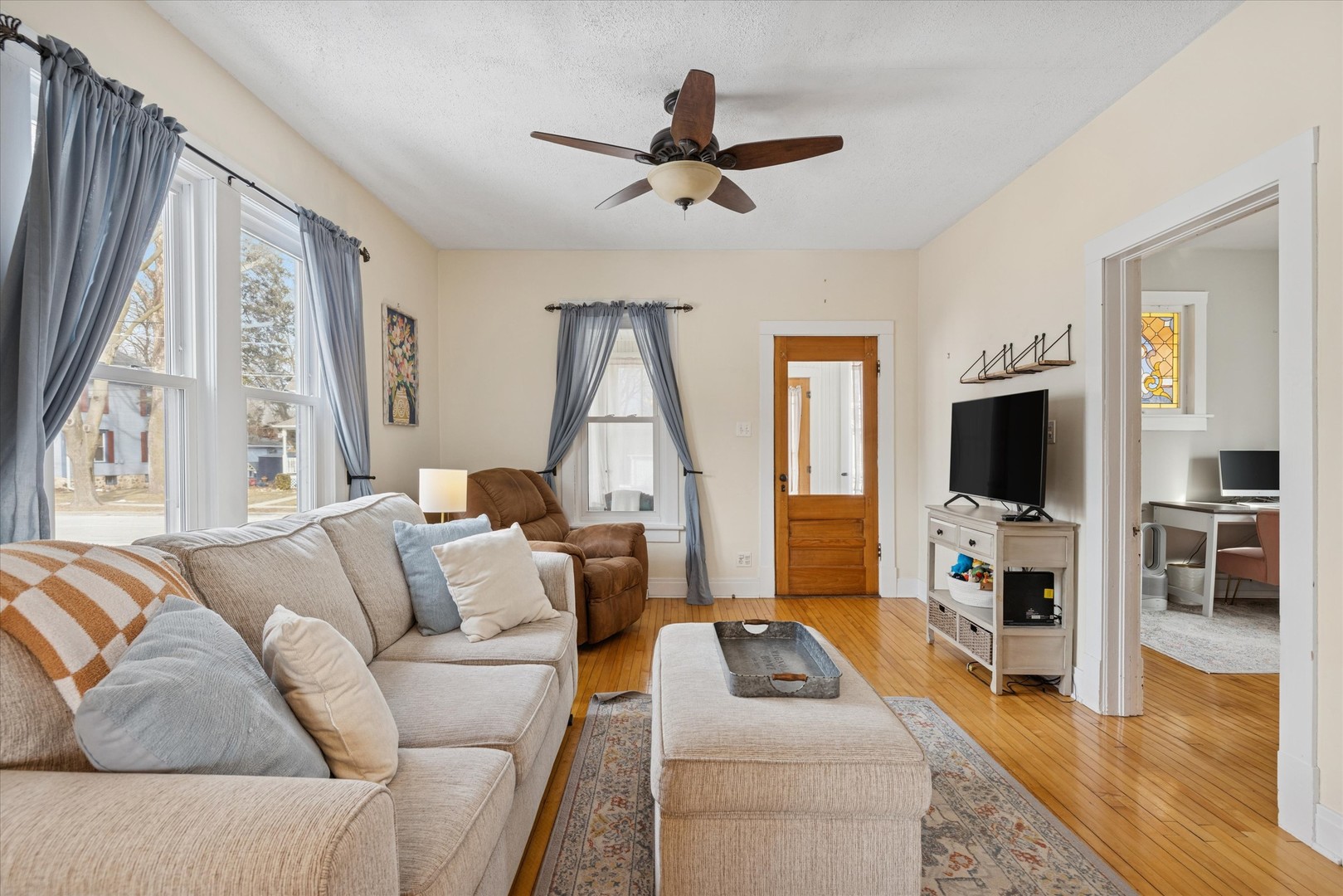 21 Division Street Algonquin, IL 60102 - Photo 4 of 20 a living room with furniture flat screen tv and a large window