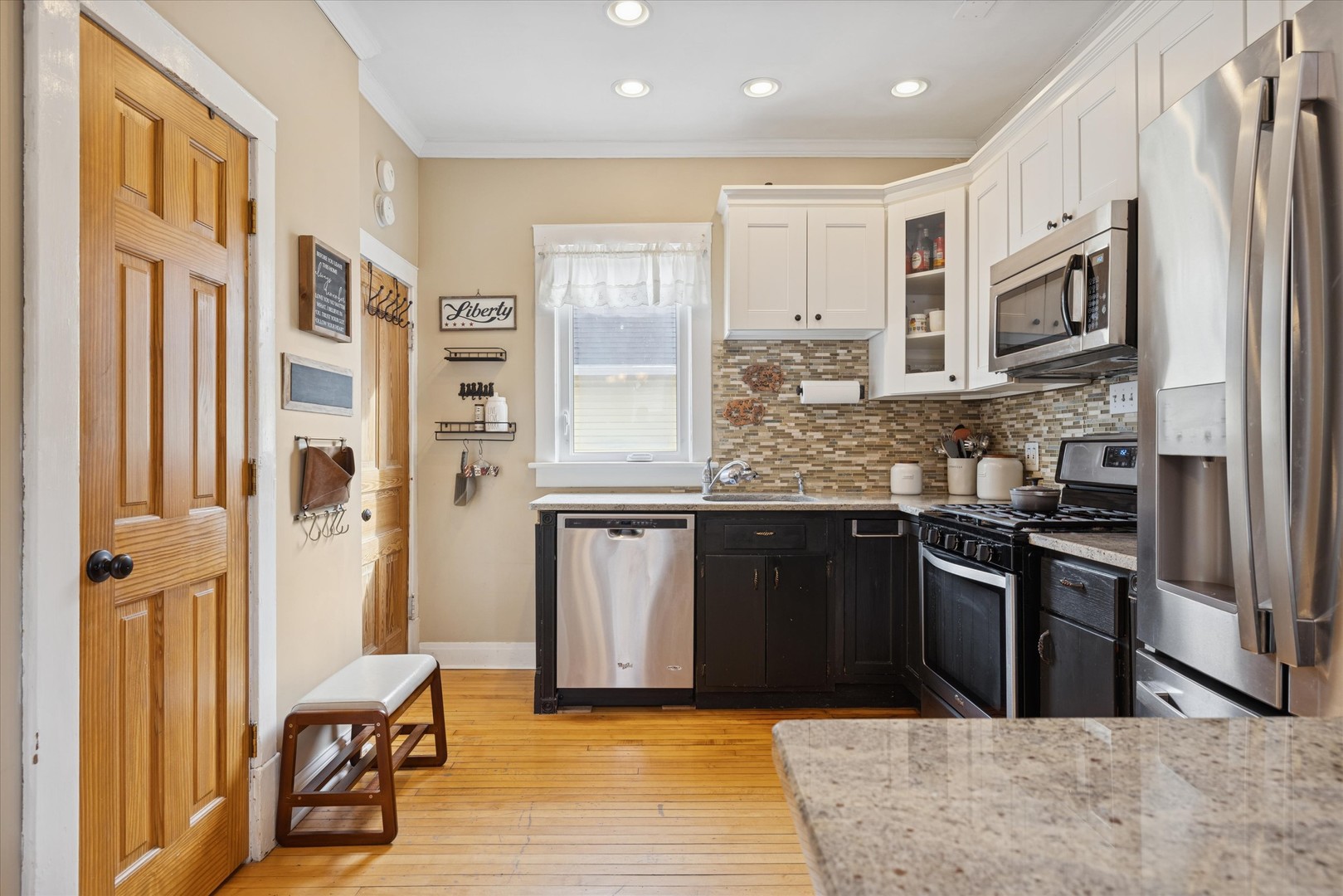 21 Division Street Algonquin, IL 60102 - Photo 10 of 20 a kitchen with stainless steel appliances granite countertop a refrigerator and a stove top oven