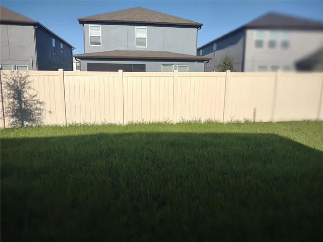 a view of backyard with a garden and plants