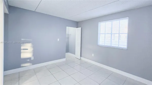a kitchen with a refrigerator and a sink