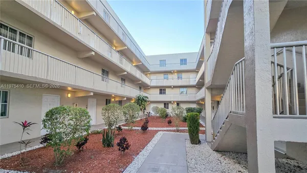a view of a city street with tall buildings