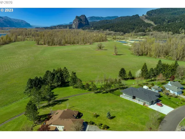 a view of a lake with a yard