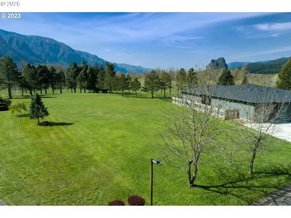 a view of a lake with a yard