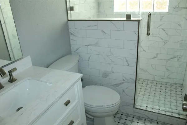 a bathroom with a sink and a toilet