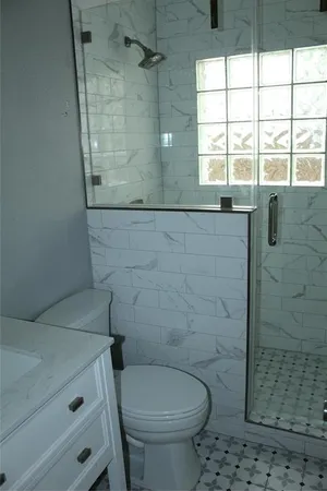 a bathroom with a sink and a toilet