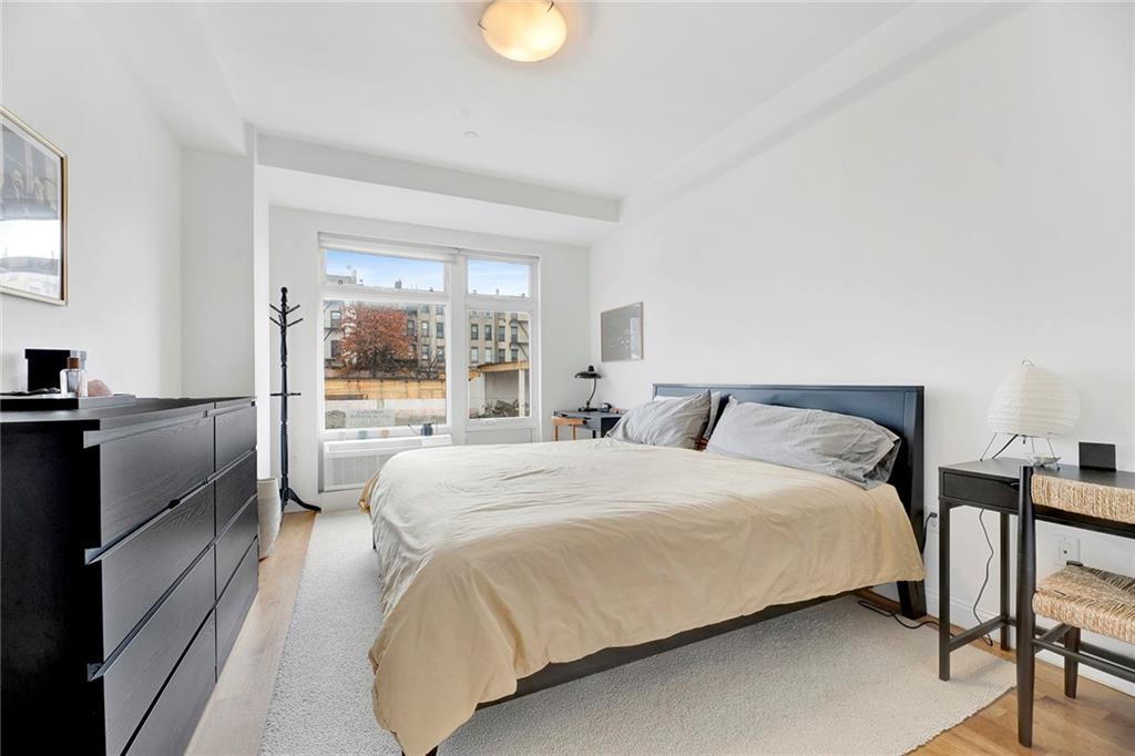26 4th Street, Unit 2D Brooklyn, NY 11231 - Photo 16 of 26 a bedroom with a bed and a view of living room