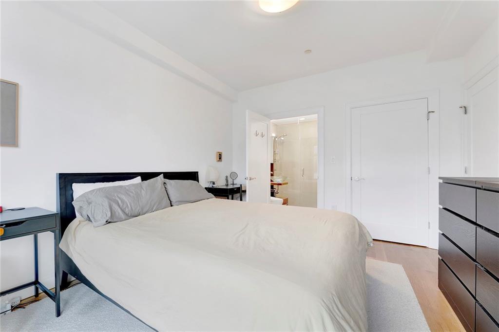 26 4th Street, Unit 2D Brooklyn, NY 11231 - Photo 17 of 26 a bedroom with a bed and a night stand