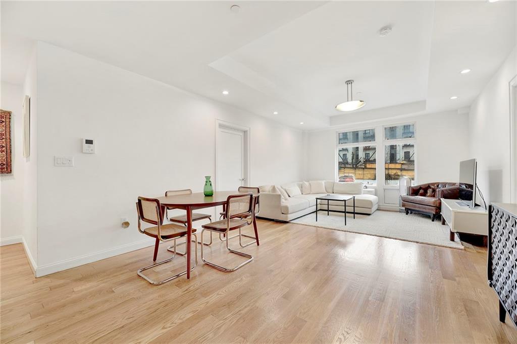26 4th Street, Unit 2D Brooklyn, NY 11231 - Photo 2 of 26 a living room with furniture and a wooden floor