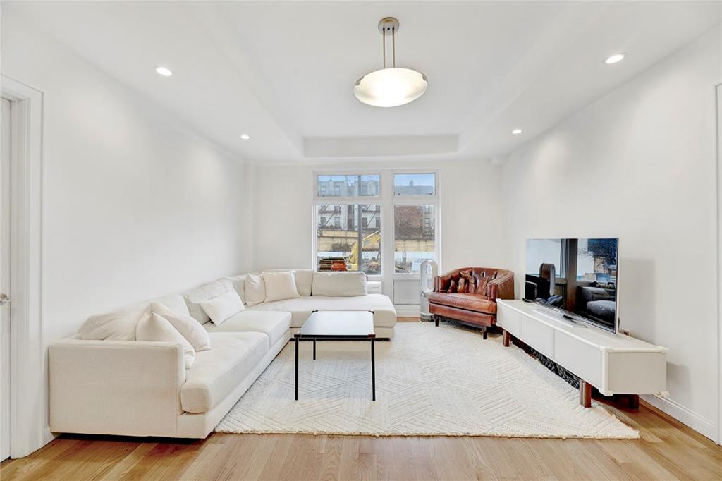 26 4th Street, Unit 2D Brooklyn, NY 11231 - Photo 4 of 26 a living room with furniture and a wooden floor
