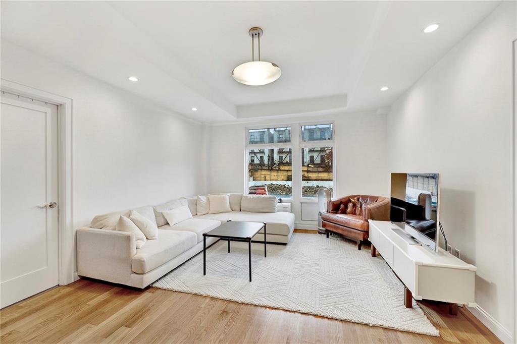 26 4th Street, Unit 2D Brooklyn, NY 11231 - Photo 5 of 26 a living room with furniture and a potted plant