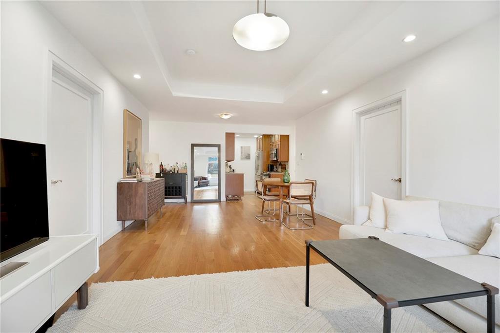 26 4th Street, Unit 2D Brooklyn, NY 11231 - Photo 6 of 26 a living room with furniture and a flat screen tv