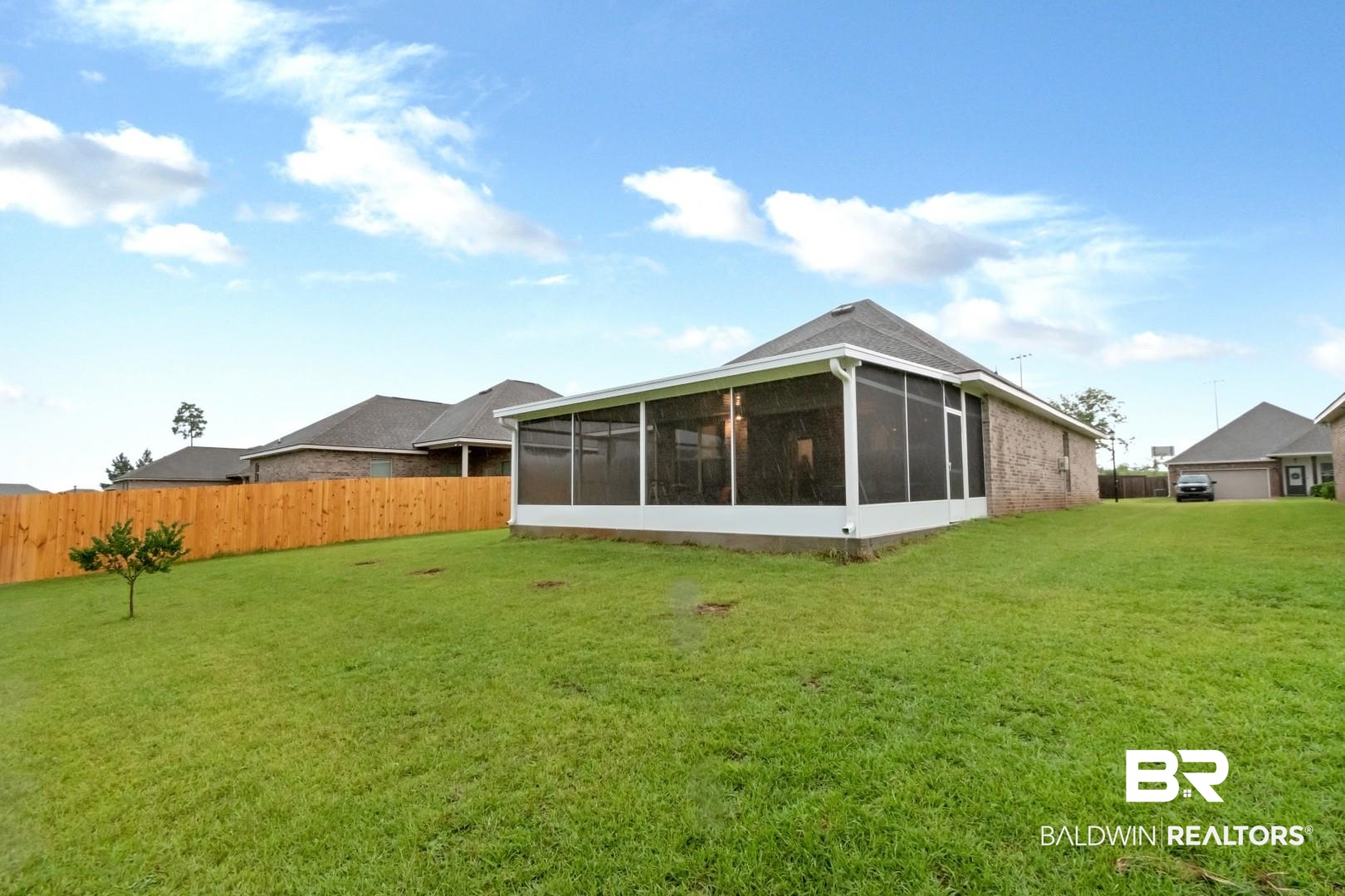 10714 Brodick Loop Spanish Fort, AL 36527 - Photo 25 of 26 Back of property featuring a sunroom