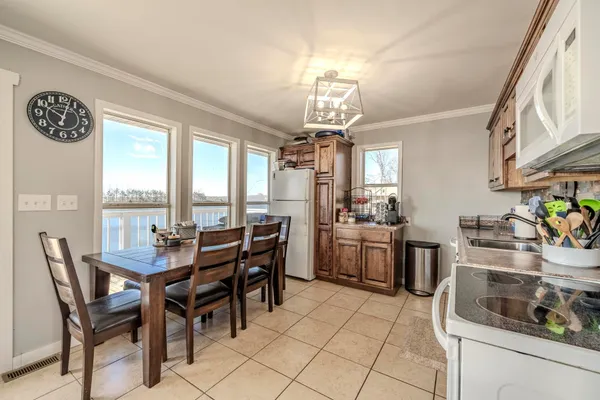 a view of a dining room with furniture window and outside view