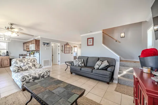 a living room with furniture and a couch