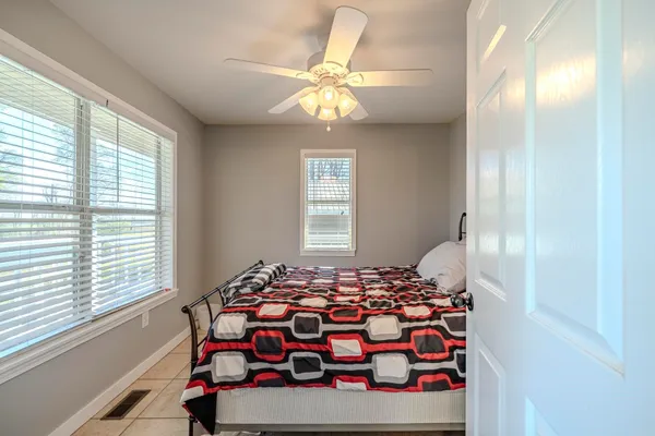 a bedroom with a bed and window