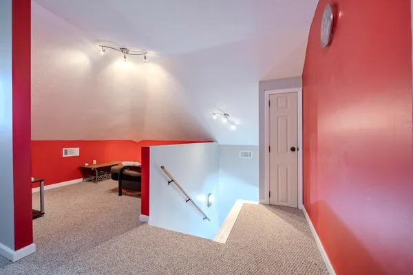 a bathroom with a sink mirror vanity and toilet