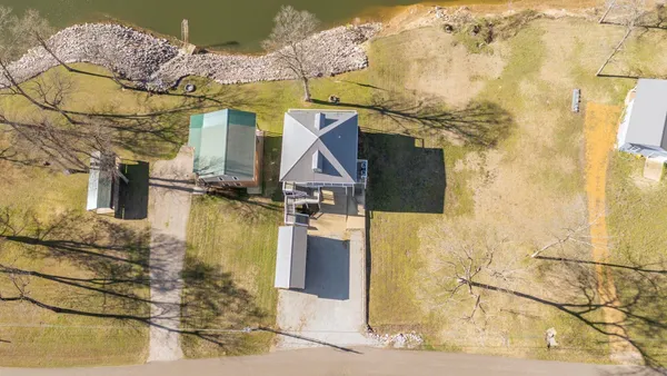 a view of a lake with a table and chairs