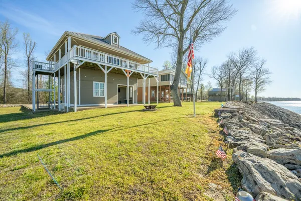 a front view of a building with a big yard