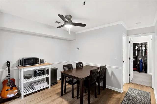 a view of a workspace with furniture and wooden floor