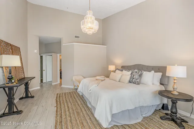 a bedroom with a bed and a table in it