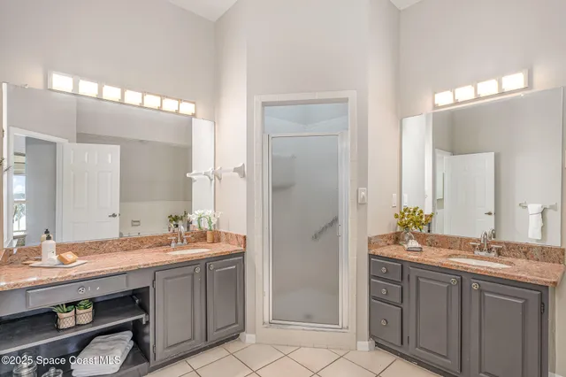 a bathroom with a sink double vanity and a mirror