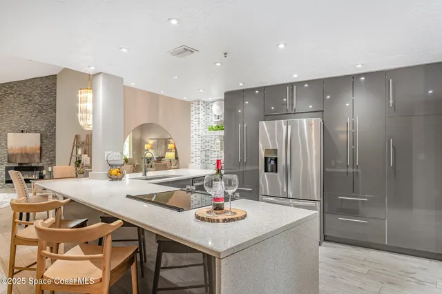a kitchen with refrigerator and couch