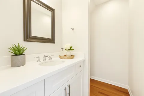 a bathroom with a sink a vanity and a mirror