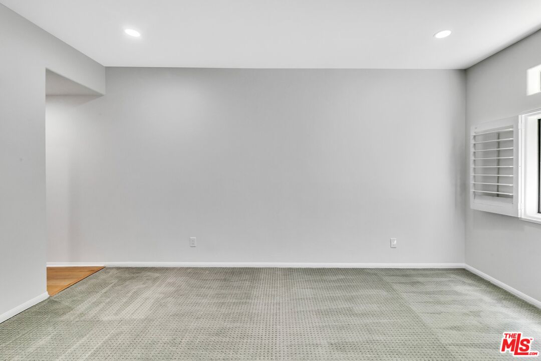 4477 Woodman Avenue, Unit 207 Sherman Oaks, CA 91423 - Photo 12 of 34 a view of an empty room with a window