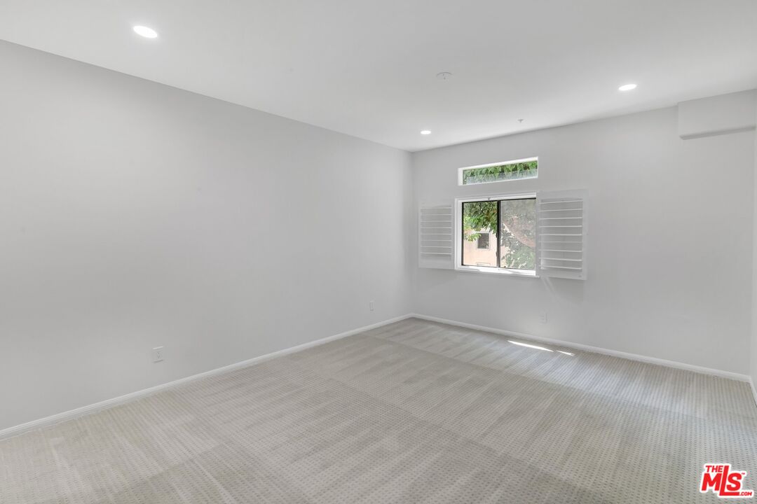 4477 Woodman Avenue, Unit 207 Sherman Oaks, CA 91423 - Photo 16 of 34 an empty room with a window