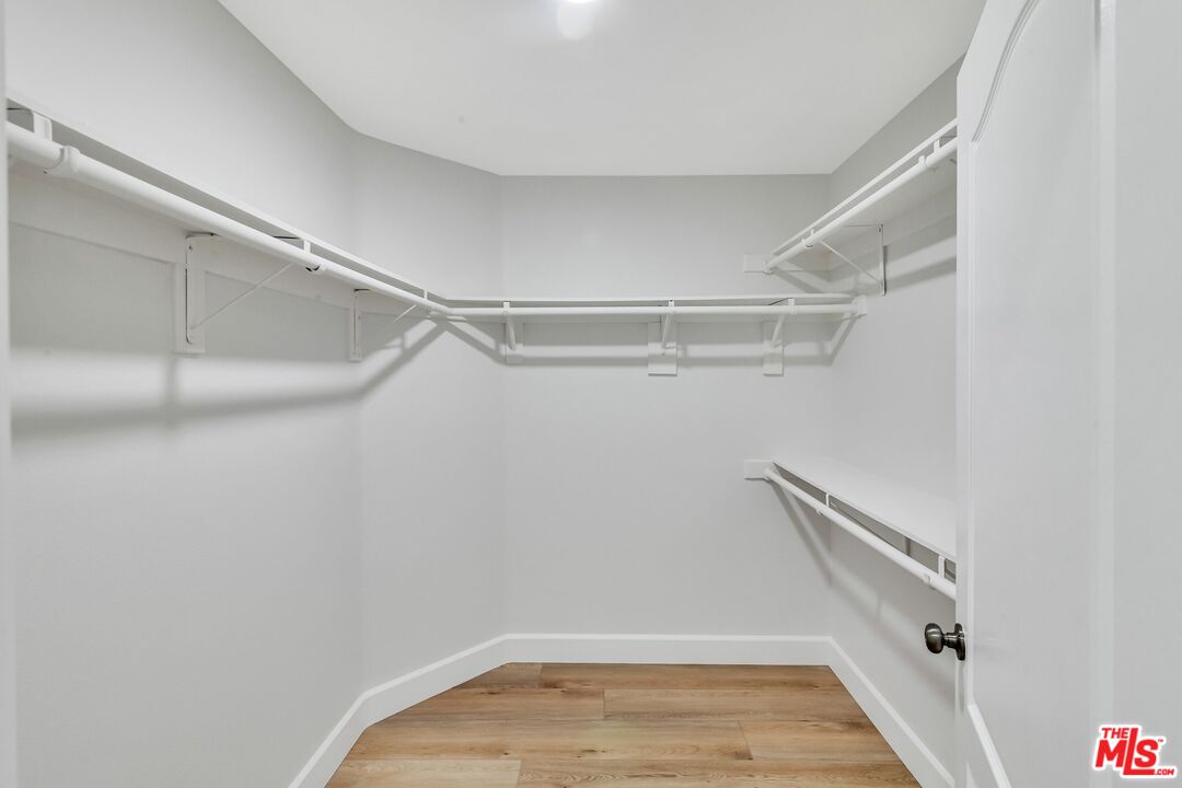 4477 Woodman Avenue, Unit 207 Sherman Oaks, CA 91423 - Photo 18 of 34 a view of a room with racks on the wall