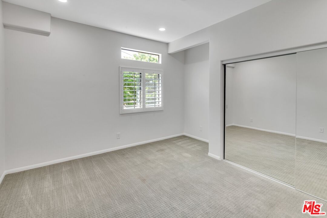 4477 Woodman Avenue, Unit 207 Sherman Oaks, CA 91423 - Photo 22 of 34 a view of an empty room with a window