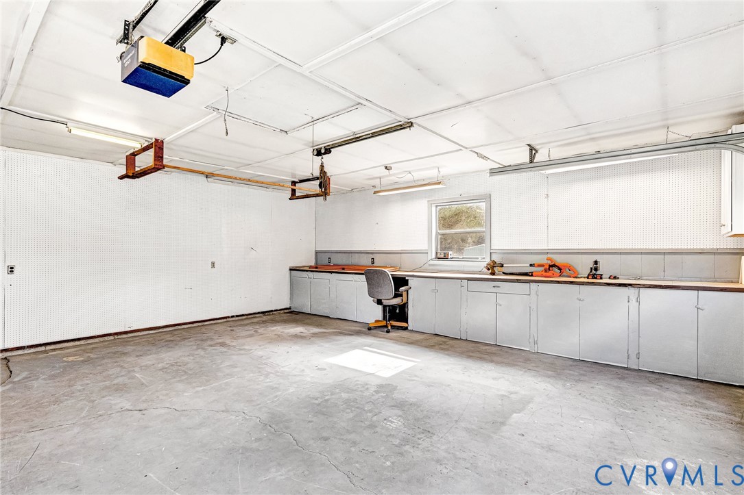14 Medlock Road Sandston, VA 23150 - Photo 24 of 38 Garage with auto door openers and work benches