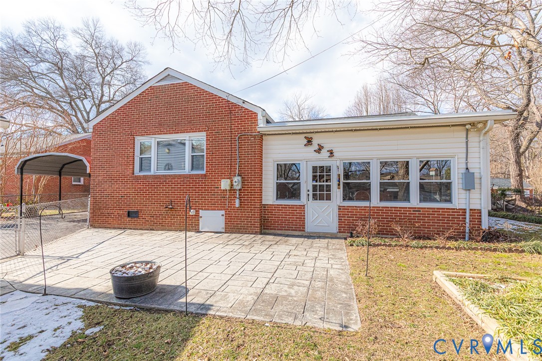 14 Medlock Road Sandston, VA 23150 - Photo 3 of 38 Rear of Home showing stamped concrete patio, enclo