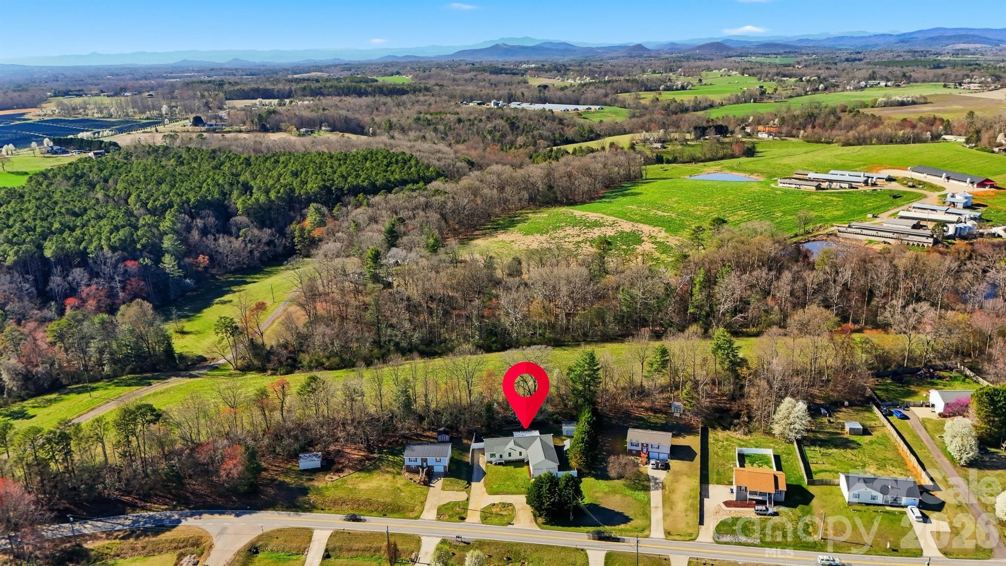 4771 Petra Mill Road Granite Falls, NC 28630 - Photo 12 of 46 an aerial view of residential houses with outdoor space and swimming pool