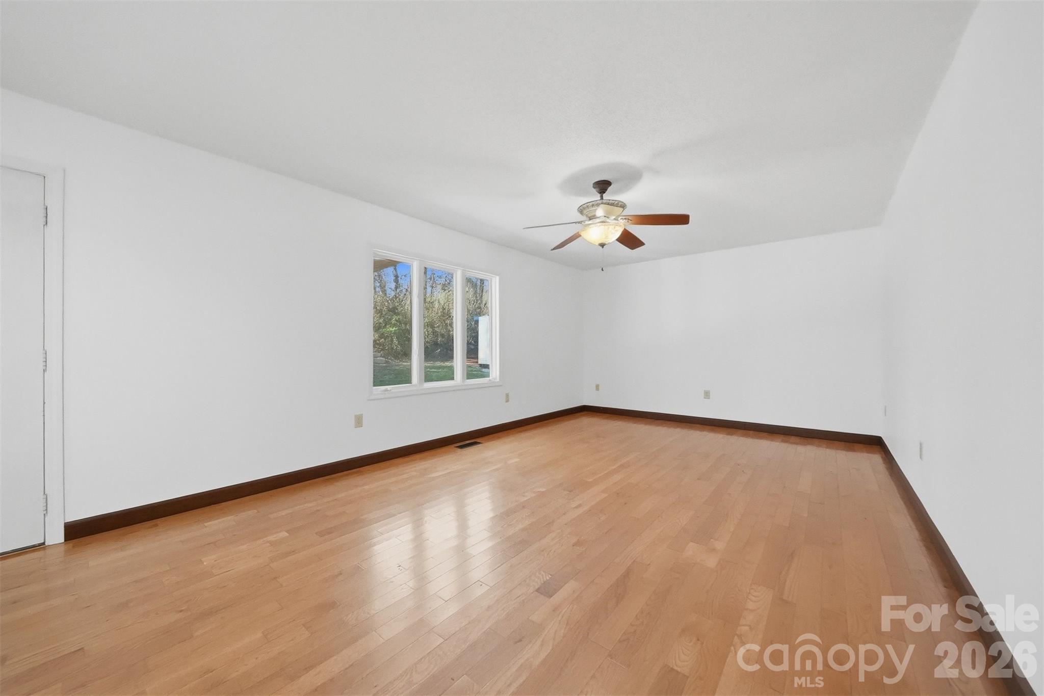 4771 Petra Mill Road Granite Falls, NC 28630 - Photo 23 of 46 a view of a room with wooden floor and white walls