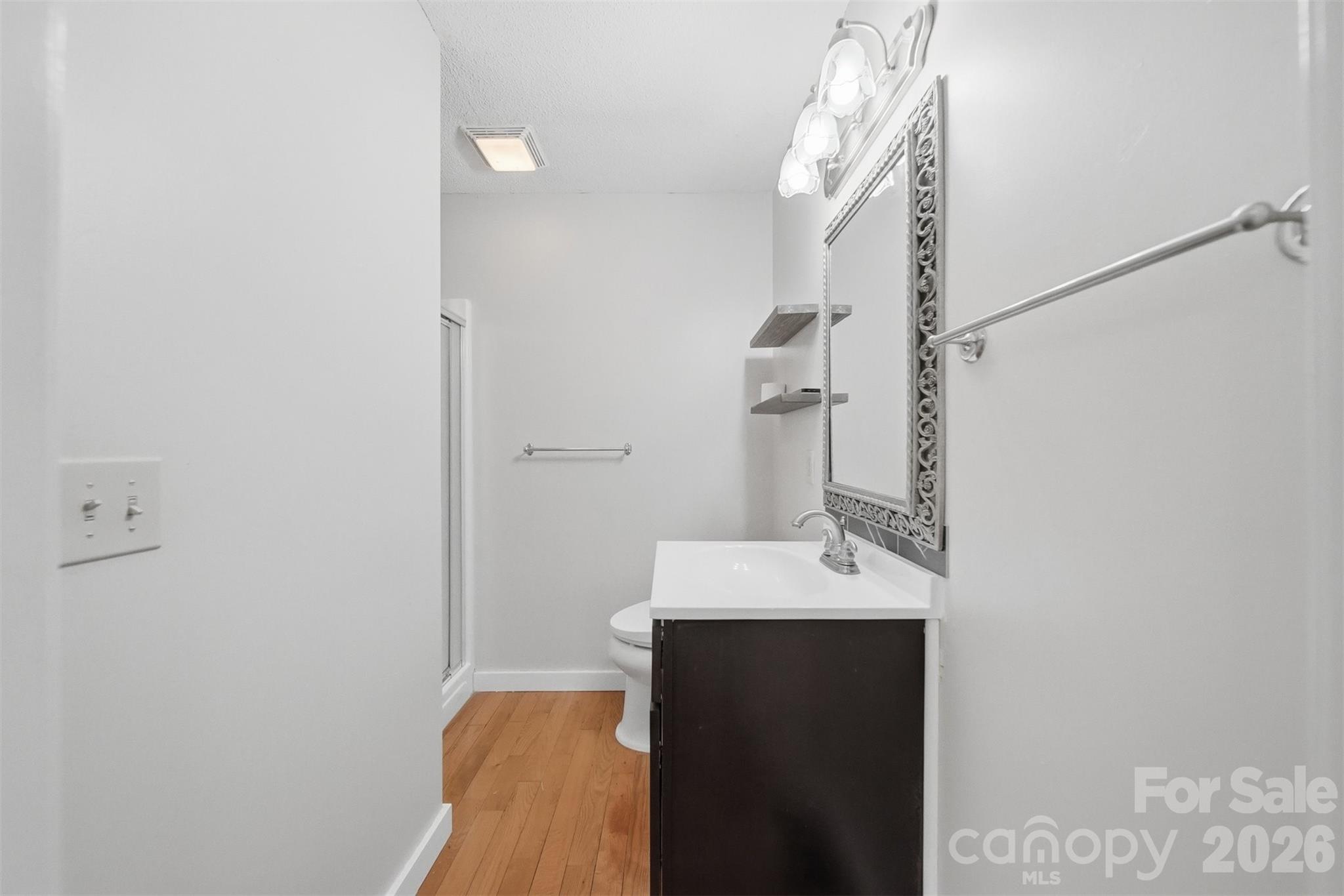 4771 Petra Mill Road Granite Falls, NC 28630 - Photo 28 of 46 a bathroom with a sink and a mirror