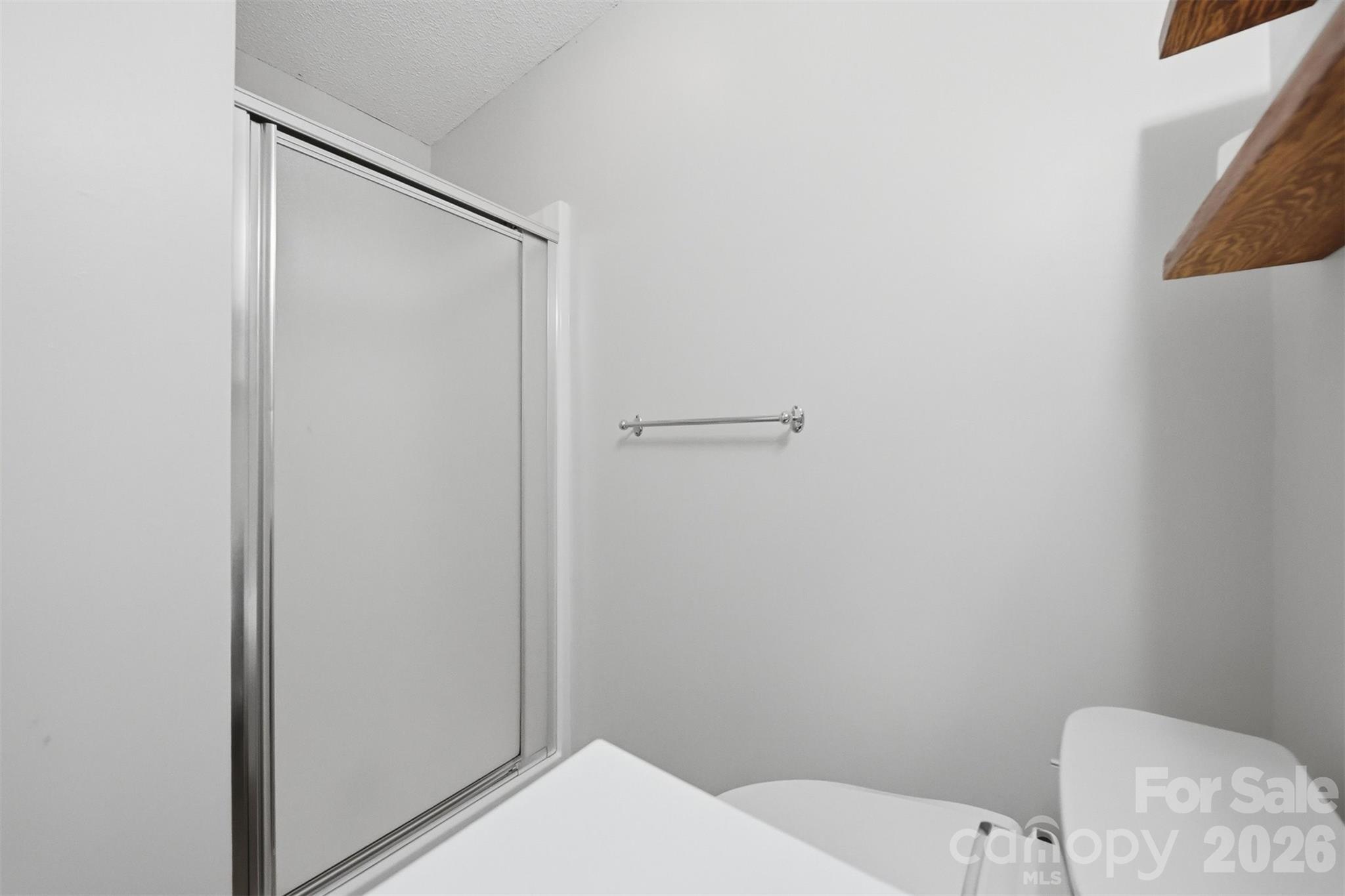 4771 Petra Mill Road Granite Falls, NC 28630 - Photo 29 of 46 a bathroom with a toilet and a shower