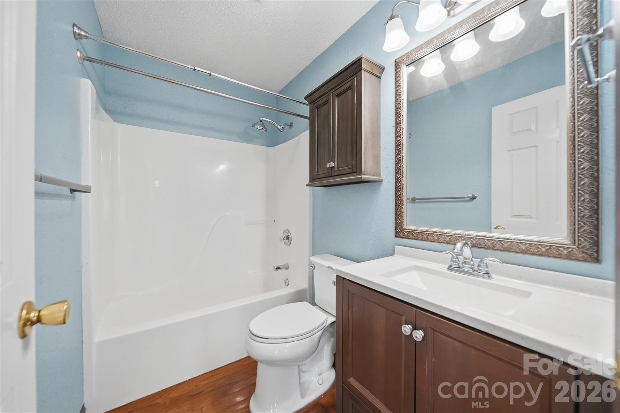 4771 Petra Mill Road Granite Falls, NC 28630 - Photo 39 of 46 a bathroom with a sink a toilet and shower