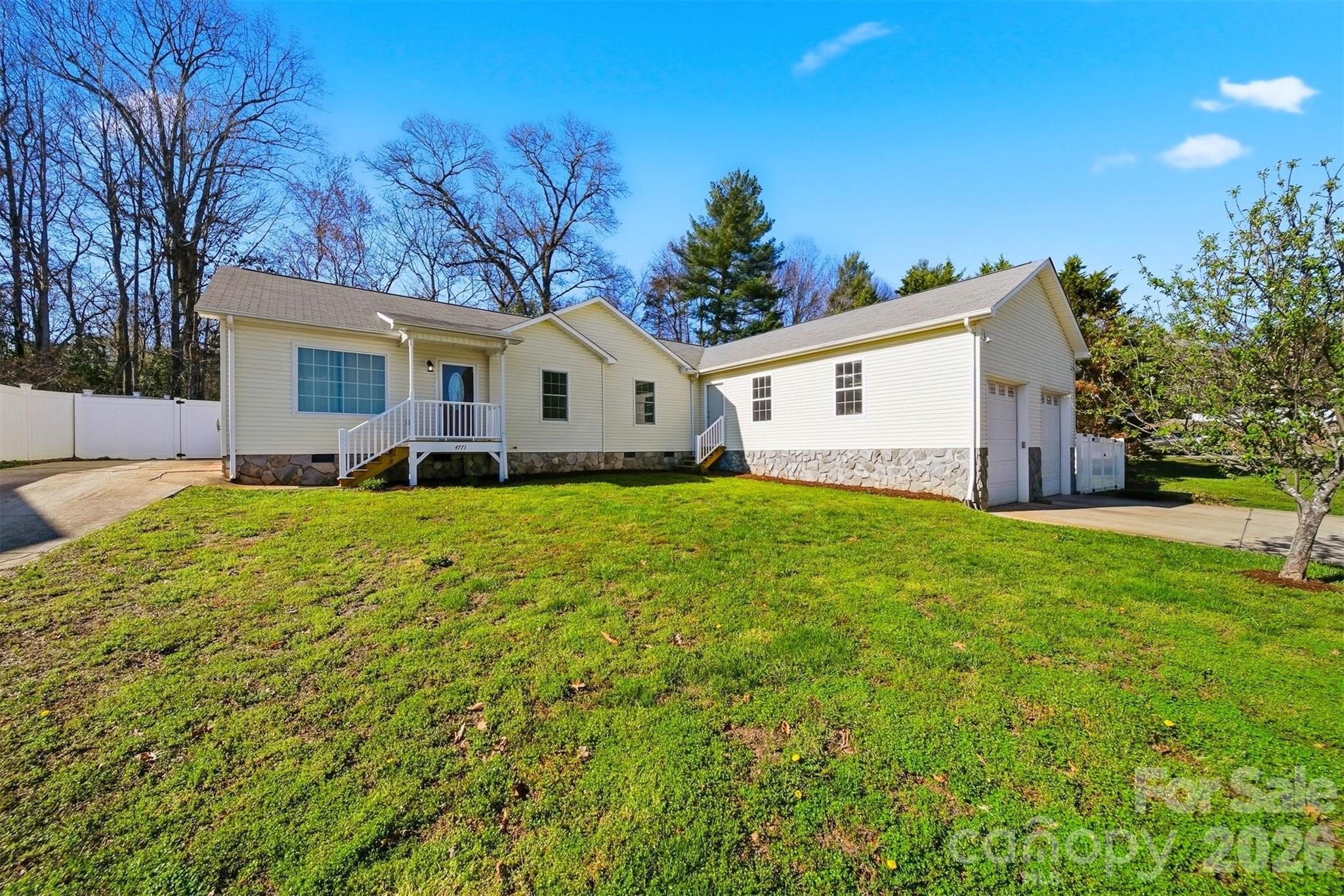 4771 Petra Mill Road Granite Falls, NC 28630 - Photo 4 of 46 a view of a house with a yard