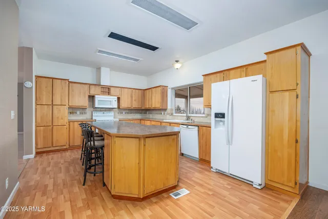 a view of balcony with wooden floor