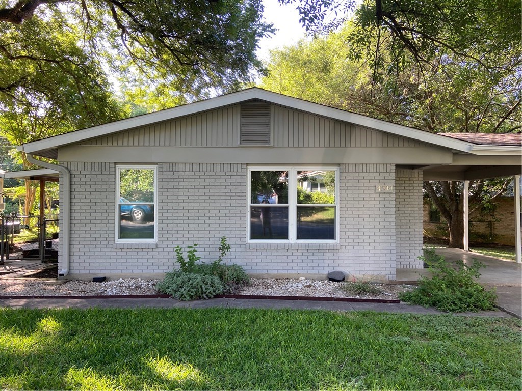4709 Everglade Drive Austin, TX 78745 - Photo 1 of 1 a view of a house with a yard