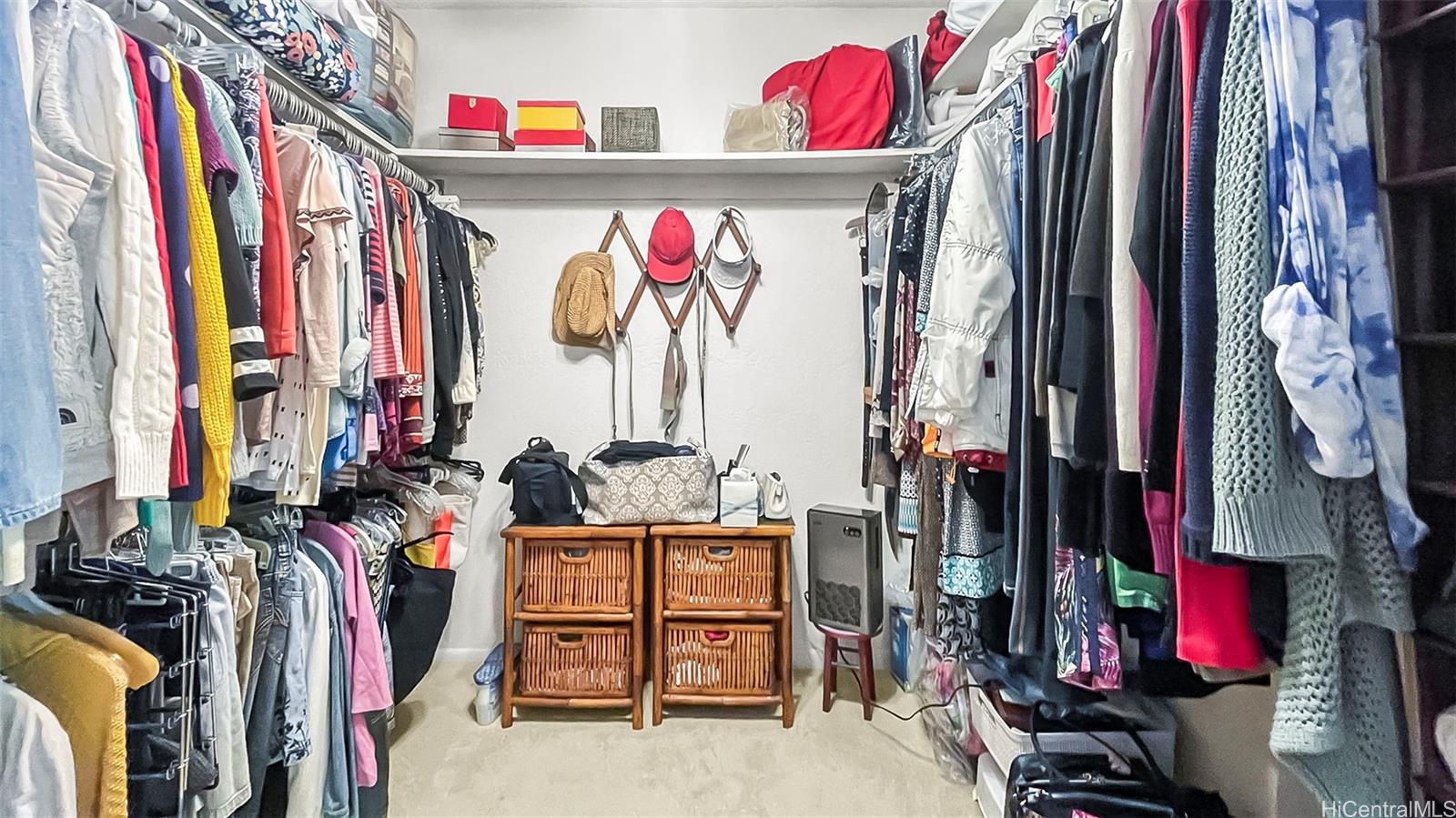 98-1421 Onikiniki Place, Unit 5 Aiea, HI 96701 - Photo 15 of 23 a view of walk in closet with clothes