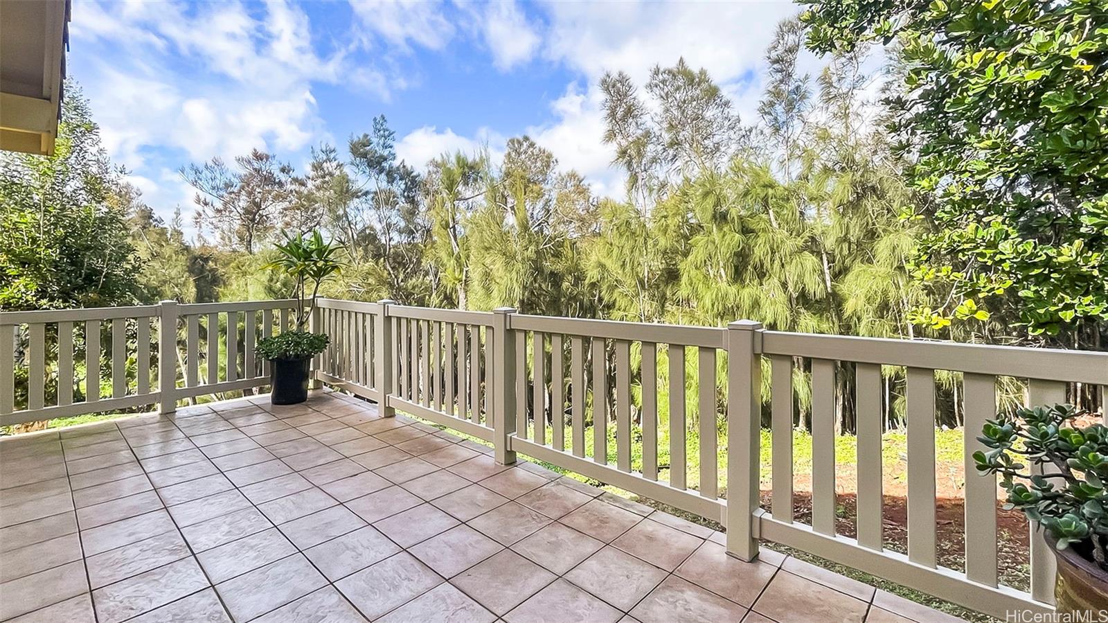 98-1421 Onikiniki Place, Unit 5 Aiea, HI 96701 - Photo 19 of 23 a view of a balcony with wooden fence