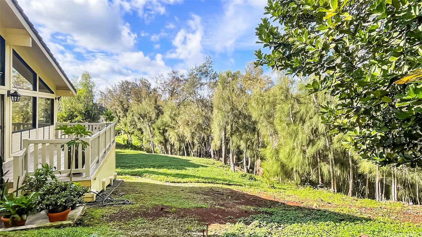 98-1421 Onikiniki Place, Unit 5 Aiea, HI 96701 - Photo 21 of 23 a view of a house with backyard and sitting area