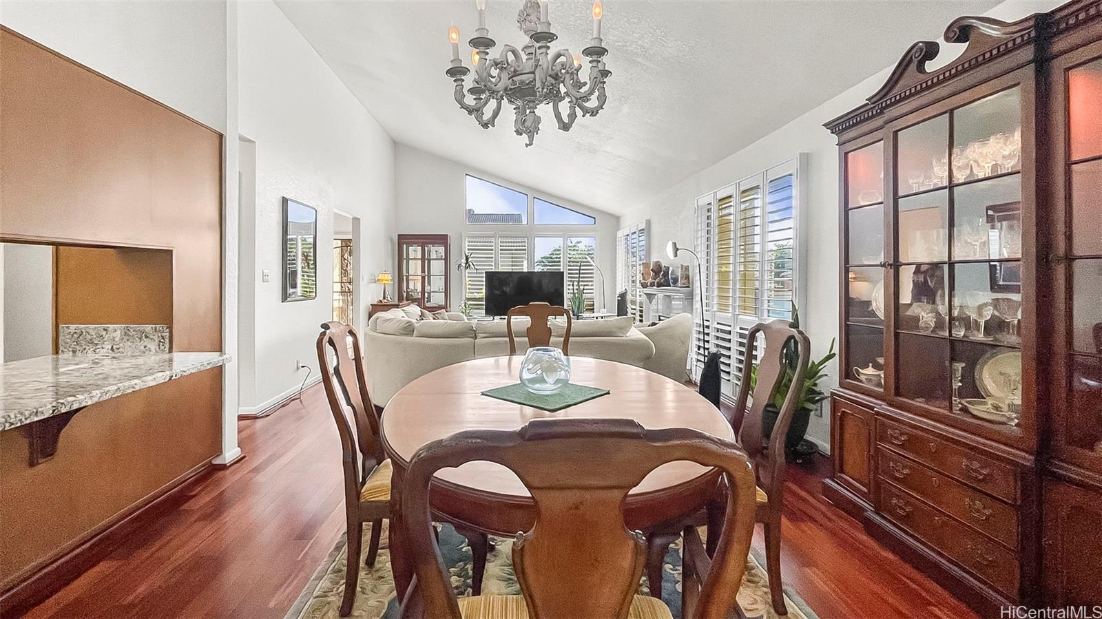 98-1421 Onikiniki Place, Unit 5 Aiea, HI 96701 - Photo 4 of 23 a view of a dining room with furniture window and outside view