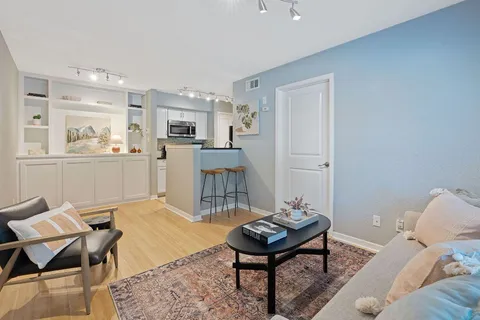 a living room with furniture and a table