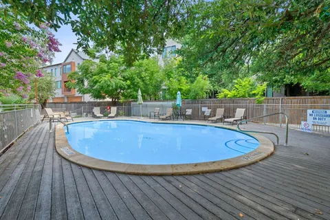 a view of a swimming pool with a patio